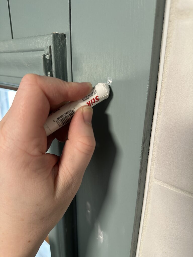 using Fil Stick to fill nail holes on shiplap board